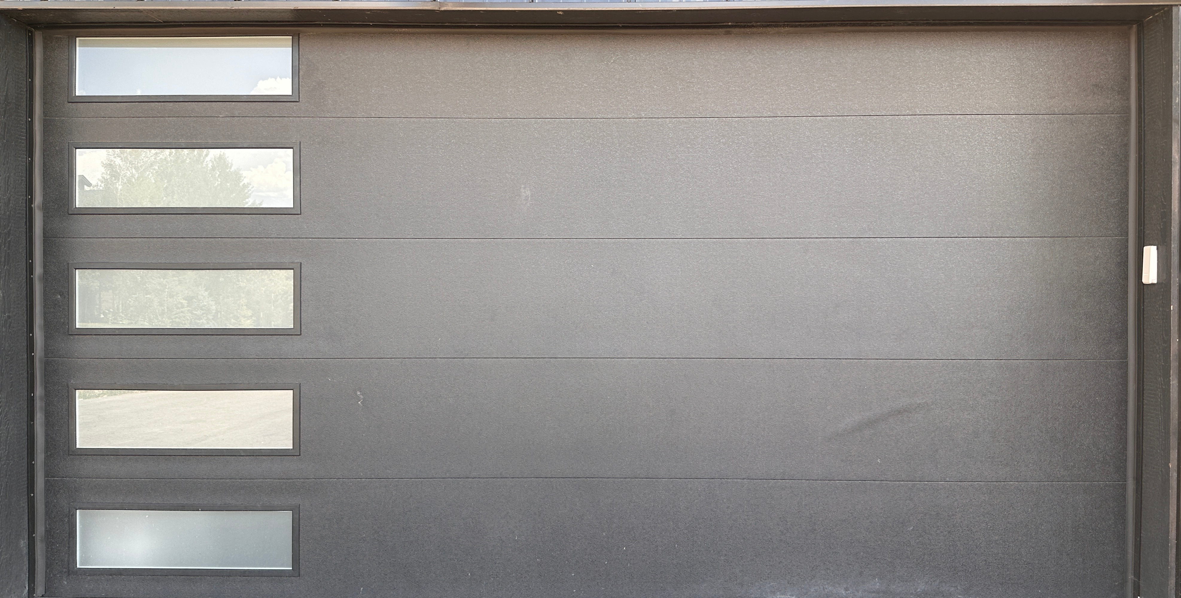 Modern steel garage door serviced by La Crosse Garage Doors in La Crosse, Wisconsin
